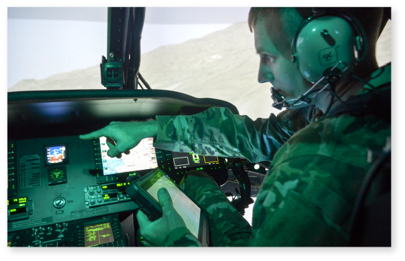 Image of a man copiloting the Black Hawk Aircrew Trainer (BAT)